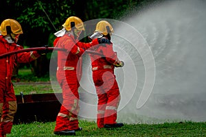Firefighter team help to use fire sprinkler to generate water curtain and protect them from fire also use to get rid of fire