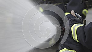 Firefighter team spay water to fire