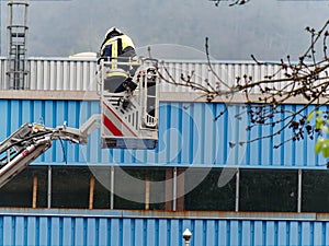Firefighter tests the turntable ladder to extinguish a possible fire.