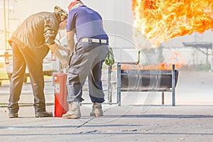Firefighter training,Instructor training how to use a fire extinguisher for fighting fire