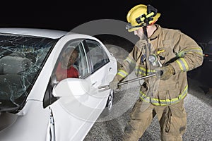 Firefighter Trying To Open Car's Door