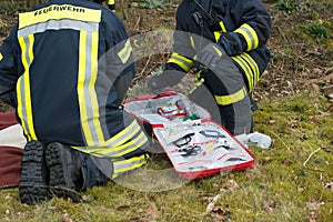 Firefighter in use with first aid kit - Serie Firefighter
