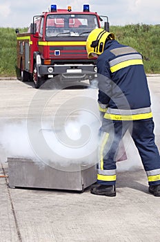 Firefighter using extinguisher