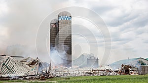 Firefighters battle silo and barn fire.