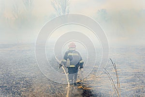 Firefighters battle a wildfire. firefighters spray water to wildfire. Australia bushfires, The fire is fueled by wind and heat