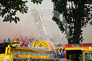 Firefighters on Buring Roof