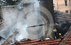 Firefighters burning house