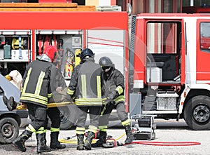 firefighters carrying the injured man with the stretcher after t