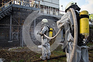 Firefighters in chemical protection suit