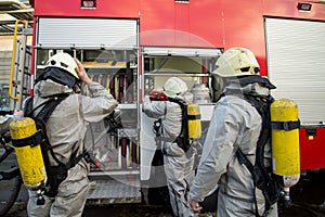 Firefighters in chemical protection suit