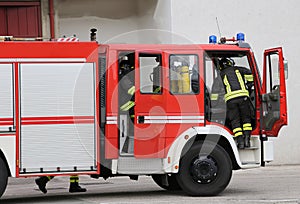 Firefighters descend quickly from firetrucks