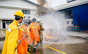 Firefighters fighting fire during training