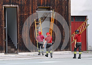 Firefighters during the fire drill mount a ladder