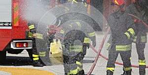 firefighters with the fire extinguisher during a practice session