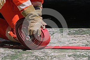 Firefighters and Fire hose coil  fire and rescue training school regularly to get ready - help,fire protection concept