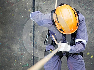 Firefighters are rappelling and climbing ropes