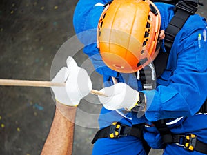 Firefighters are rappelling and climbing ropes