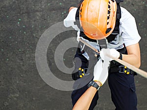 Firefighters are rappelling and climbing ropes