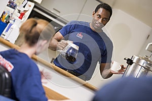 Firefighters relaxing in the staff kitchen