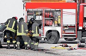 firefighters rescue an injured person after an accident