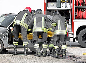 firefighters at the rescue to the injured with a stretcher after