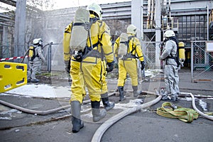 Firefighters and rescuers in a radiation protection, chemical protection suit photo