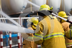 Firefighters spray water in fire extinguishers caused by explosive gas