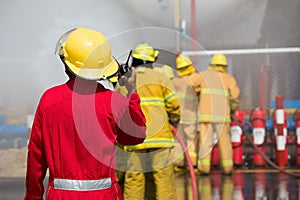 Firefighters spray water in fire extinguishers caused by explosive gas