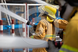 Firefighters spray water in fire extinguishers caused by explosive gas