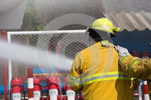 Firefighters spray water in fire extinguishers caused by explosive gas