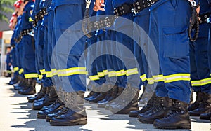 Firefighters in their uniforms standing in line