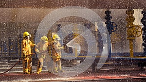 Firefighters training, foreground is drop of water springer