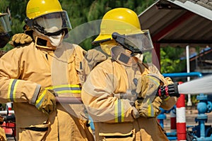 Firefighters training, foreground is drop of water springer, Selective focus