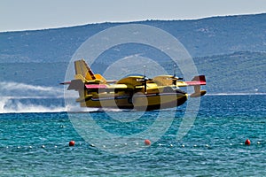 Firefighting aircraft landing for pick up water