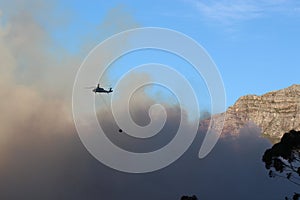 Firefighting helicopter among the mountains