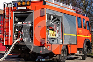 Firefighting vehicle with hose