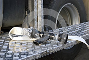 Firehose in a truck to be used by firefight.