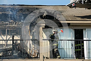 Fireman with axe at apartment fire