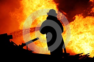 Fireman controlling a huge fire