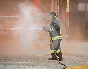 Fireman extinguishes the great fire with the hydrant