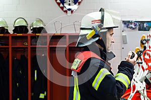 Fireman in a fire department spark with radios set photo