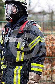 Fireman with fireproof clothing and respirator