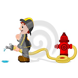 Fireman holding a yellow water hose