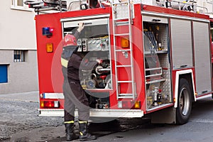 Fireman near a fire engine