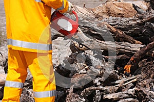 Fireman near open wood fire