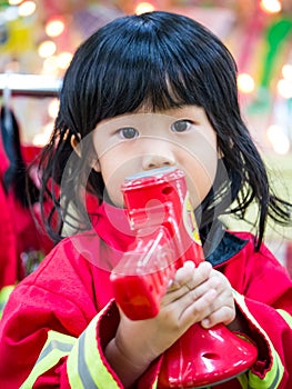 Fireman occupation role playing girl