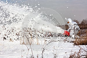 Fireman pouring flame with firefighting foam