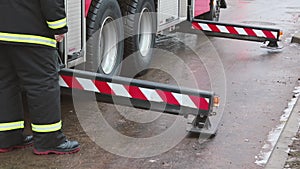 Fireman prepares special equipment for the evacuation of victims from high-rise buildings