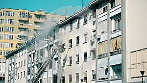 fireman put out the fire of apartments from crane ladder