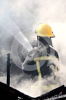 Fireman Putting out a House Fire